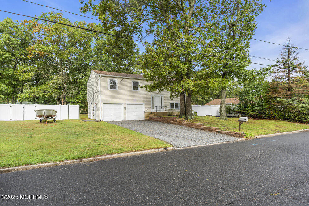 32 Pine Tree Drive Bayville, NJ 08721 - Photo 62 of 63 a house view with a outdoor space