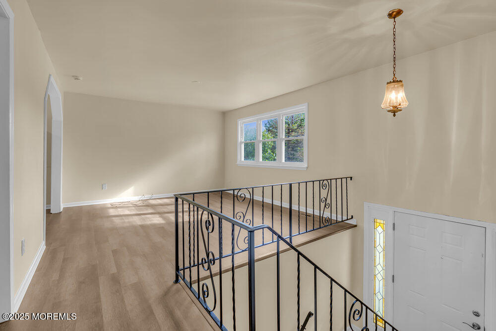 32 Pine Tree Drive Bayville, NJ 08721 - Photo 7 of 63 a view of empty room with windows