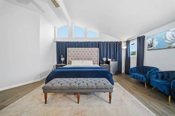 a view of walk in closet with clothes