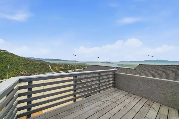 a bedroom with a bed and a refrigerator