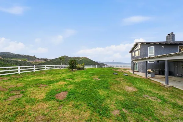 an aerial view of residential house and sandy dunes
