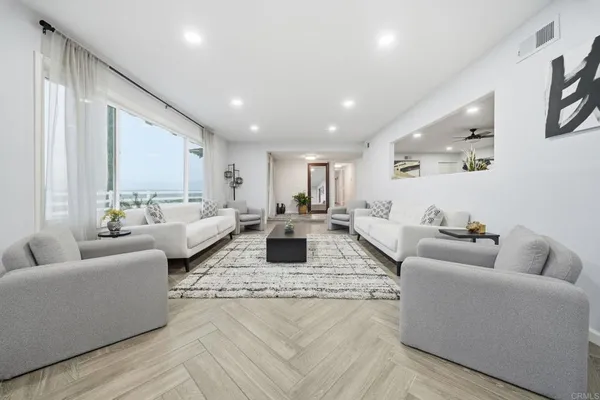 a living room with furniture and a large window
