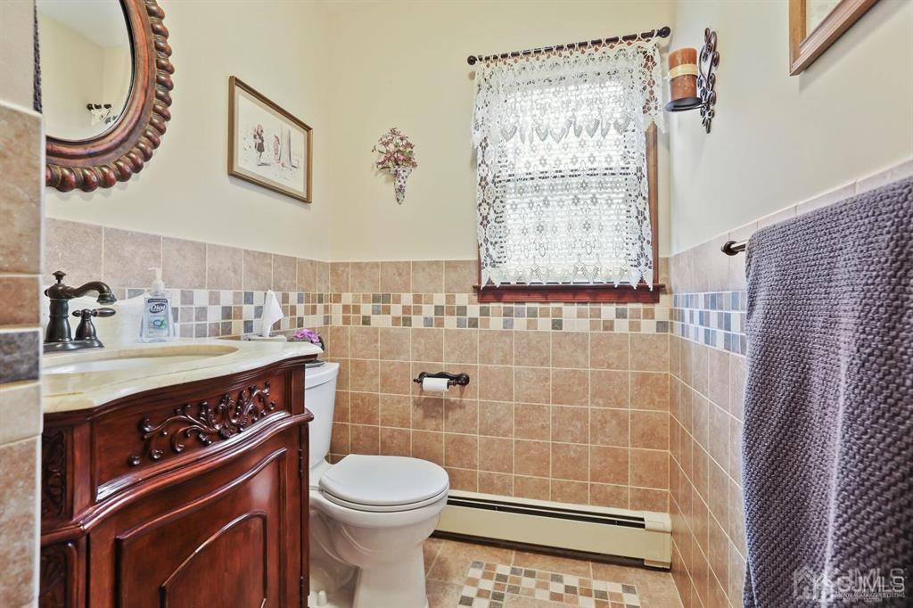 10 Bennett Road Old Bridge, NJ 07747 - Photo 15 of 35 a bathroom with a sink a toilet and shower