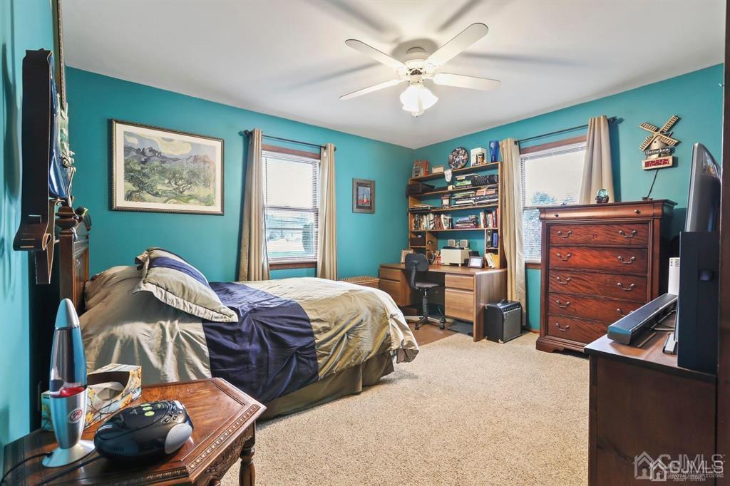 10 Bennett Road Old Bridge, NJ 07747 - Photo 18 of 35 a bedroom with two bed and a bookshelf