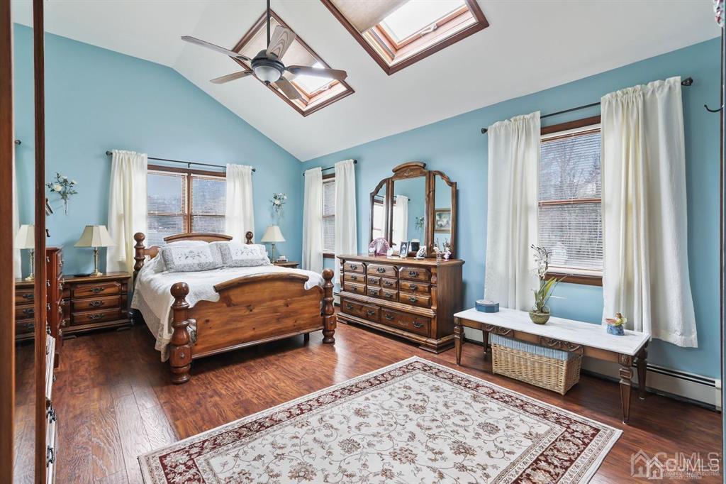10 Bennett Road Old Bridge, NJ 07747 - Photo 21 of 35 a bedroom with a bed a chandelier and a window