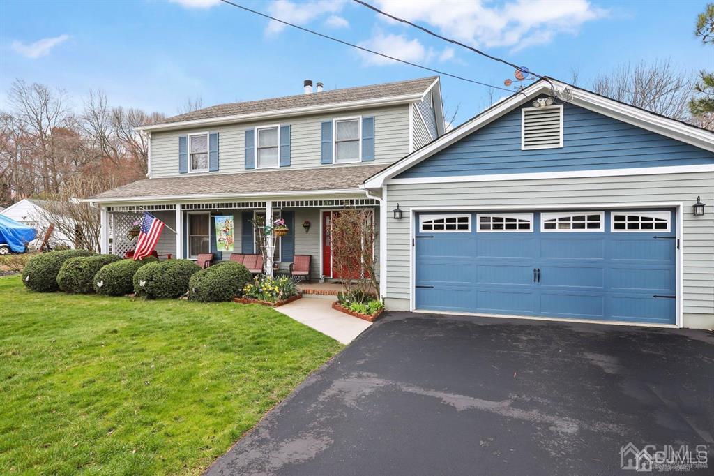 10 Bennett Road Old Bridge, NJ 07747 - Photo 24 of 35 a front view of a house with a yard and garage