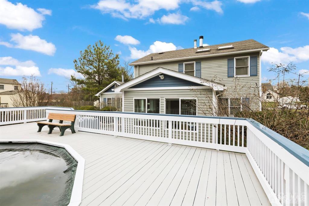 10 Bennett Road Old Bridge, NJ 07747 - Photo 26 of 35 a roof deck with a table and chairs