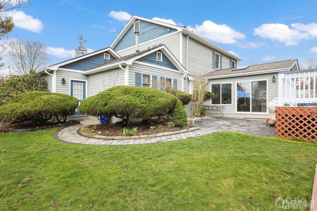 10 Bennett Road Old Bridge, NJ 07747 - Photo 33 of 35 a view of a house with a yard and potted plants