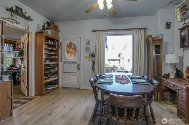a view of a dining room with furniture and chandelier