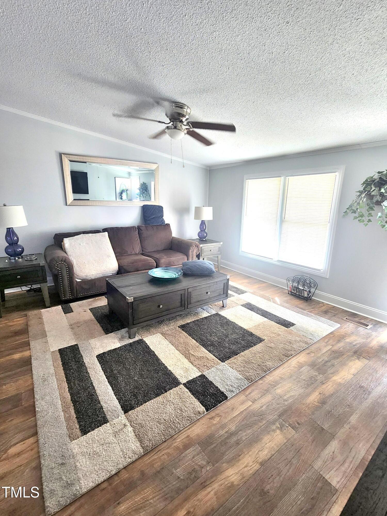 4101 Hopkins Road Middlesex, NC 27557 - Photo 15 of 17 a living room with furniture and a window