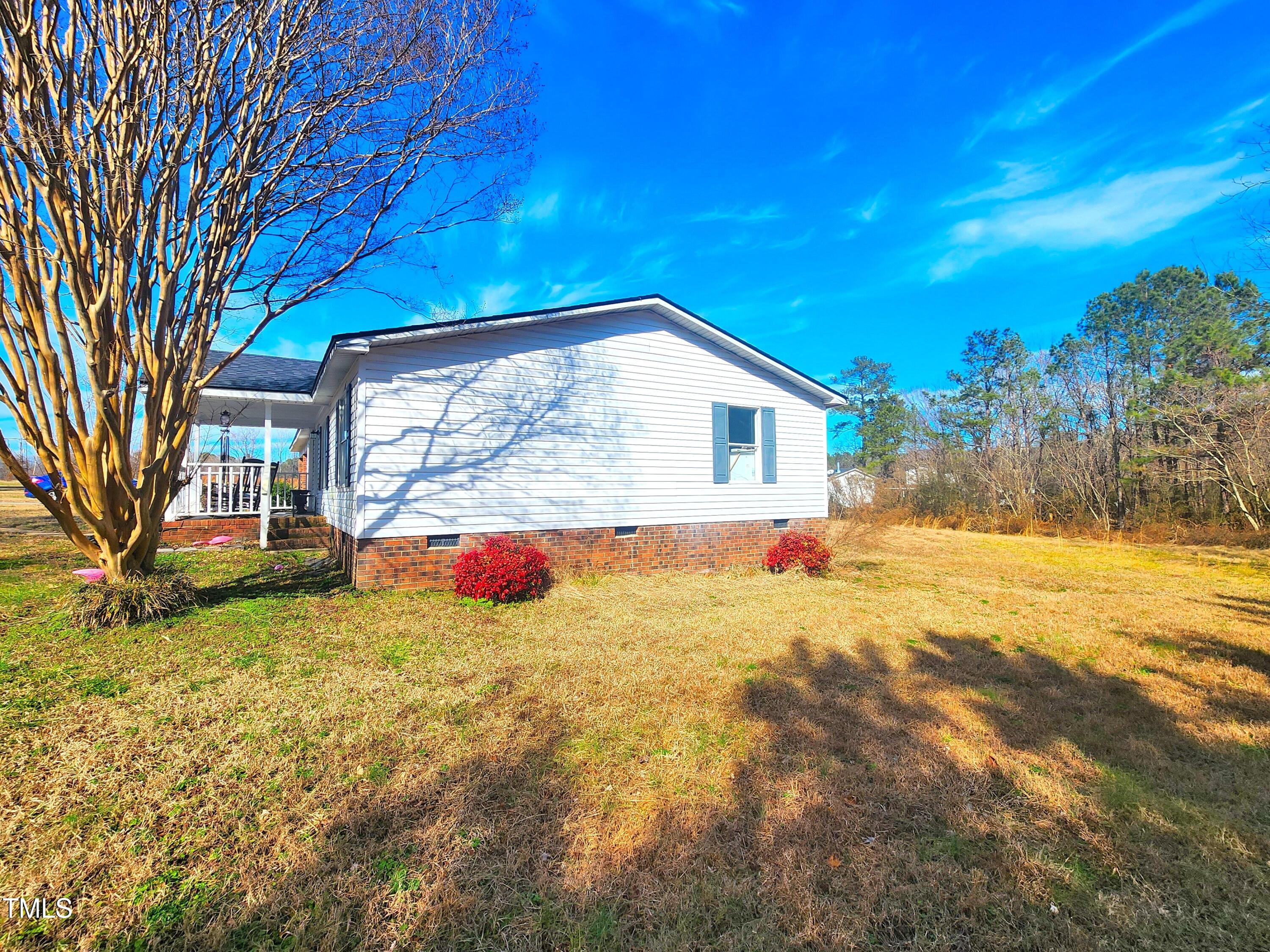 4101 Hopkins Road Middlesex, NC 27557 - Photo 16 of 17 a view of a house with a yard