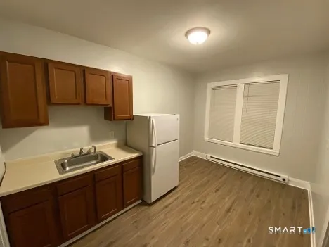 a kitchen with a sink a stove and refrigerator