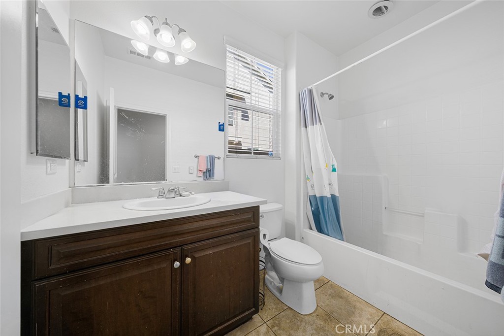 12936 Canopy Court Rancho Cucamonga, CA 91739 - Photo 13 of 30 a bathroom with a sink a toilet a mirror and shower