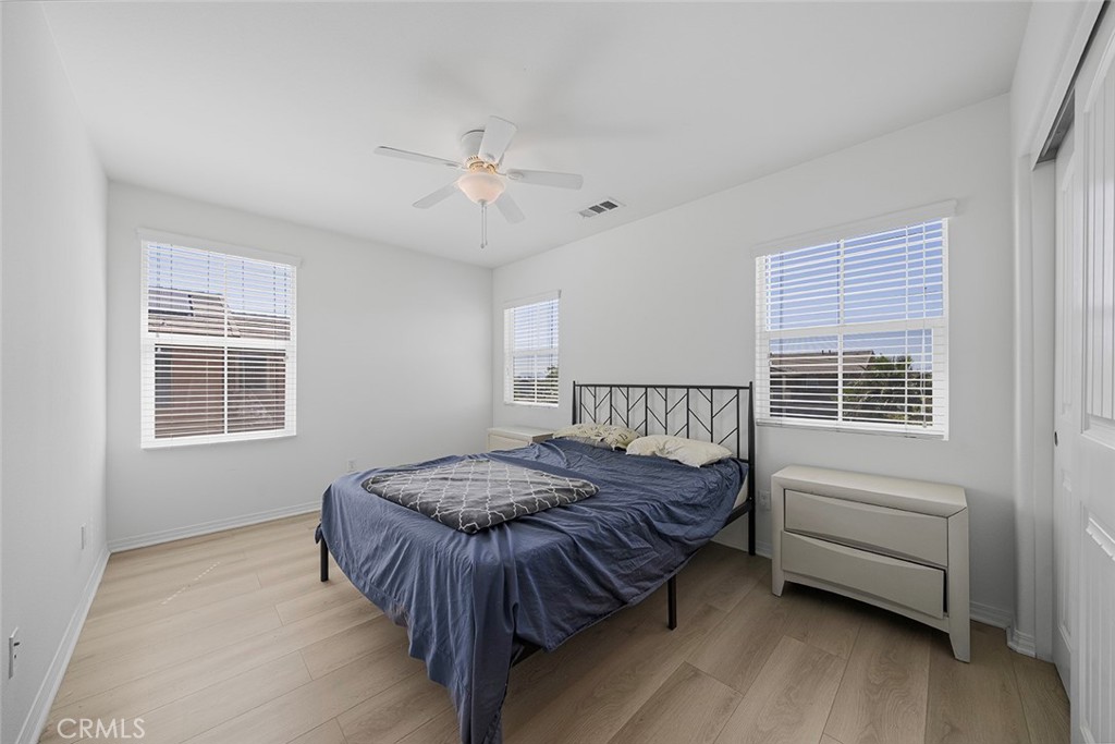 12936 Canopy Court Rancho Cucamonga, CA 91739 - Photo 14 of 30 a bed sitting in a bedroom next to a window