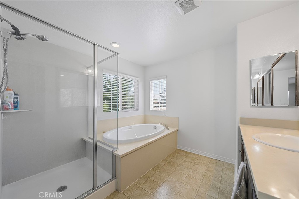 12936 Canopy Court Rancho Cucamonga, CA 91739 - Photo 21 of 30 a bathroom with a tub a toilet and a sink