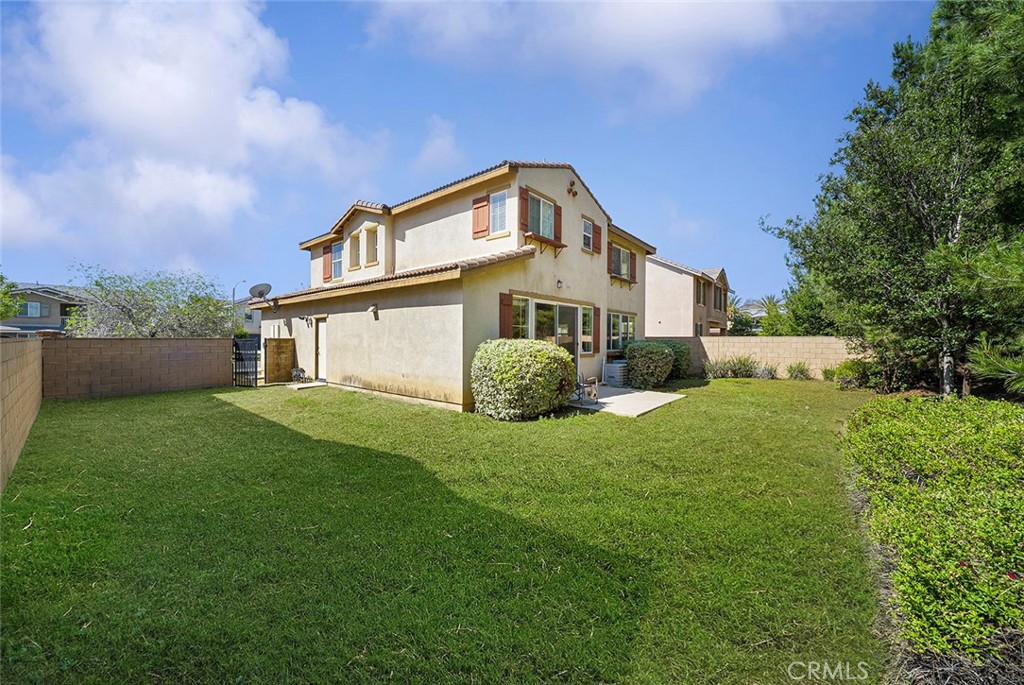 12936 Canopy Court Rancho Cucamonga, CA 91739 - Photo 27 of 30 a view of a house with a big yard plants and large trees