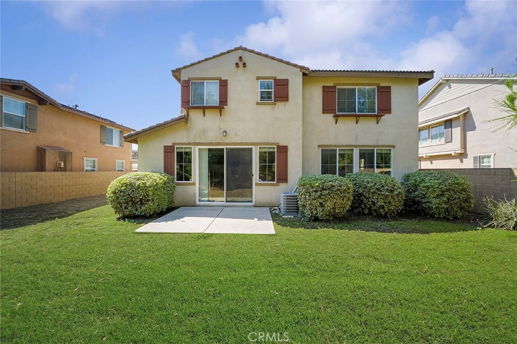 12936 Canopy Court Rancho Cucamonga, CA 91739 - Photo 28 of 30 a front view of a house with a yard