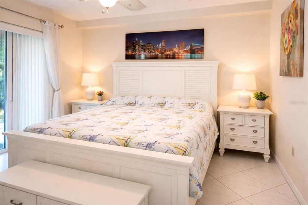 3637 Downfield Place, Unit 402 New Port Richey, FL 34655 - Photo 11 of 39 a bedroom with a bed and a window