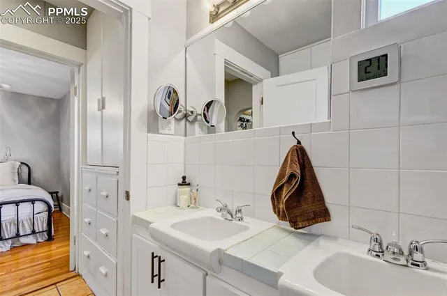 a bathroom with a sink and a mirror