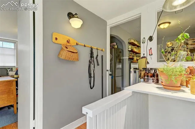 a bedroom with a bed and a mirror