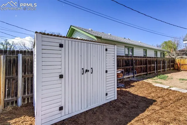 a view of backyard with cabin
