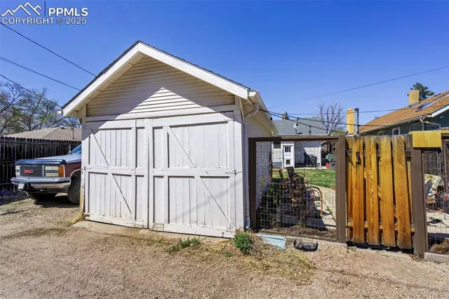 a view of backyard with cabin