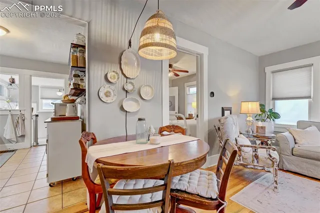 a dining room with furniture and window
