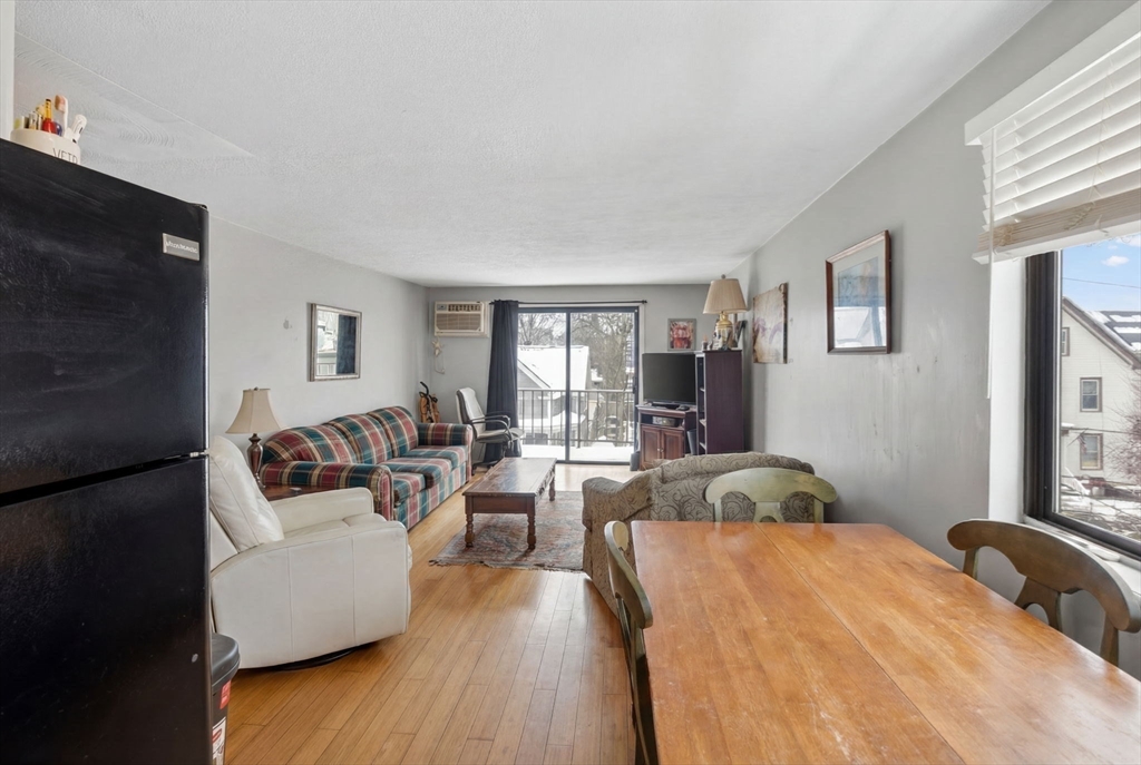 10-16 Stephen Street, Unit 5 Lynn, MA 01902 - Photo 11 of 26 a living room with furniture and a flat screen tv