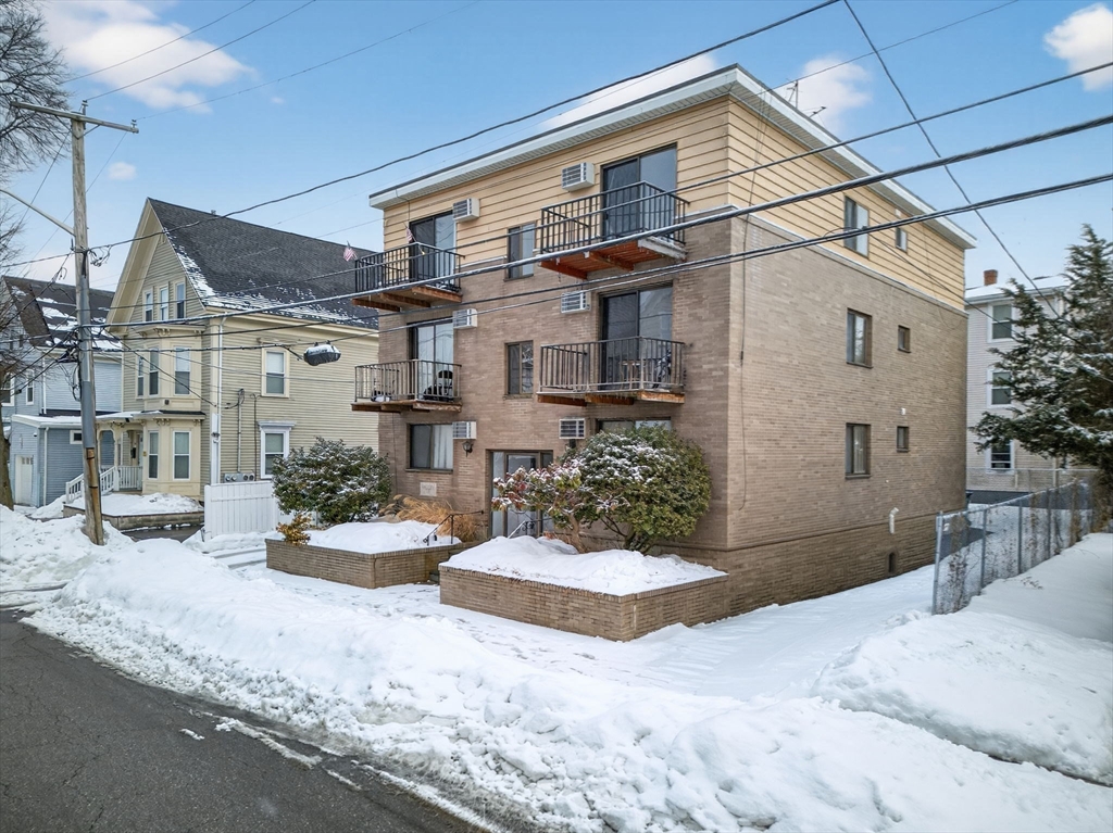 10-16 Stephen Street, Unit 5 Lynn, MA 01902 - Photo 20 of 26 a view of a house with backyard and sitting area