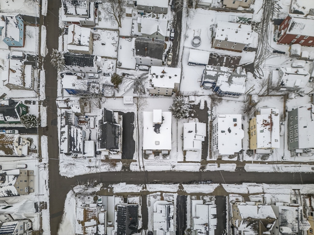 10-16 Stephen Street, Unit 5 Lynn, MA 01902 - Photo 24 of 26 a large building with a lot of windows and chairs