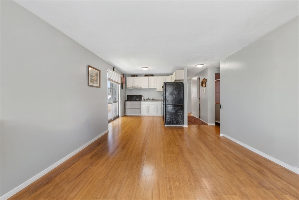 10-16 Stephen Street, Unit 5 Lynn, MA 01902 - Photo 6 of 26 a view of empty room with wooden floor
