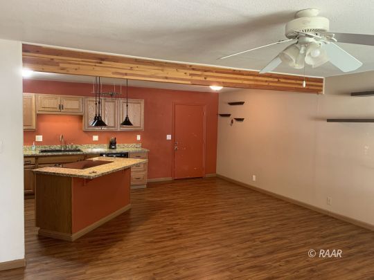 1004 South Farragut Street Ridgecrest, CA 93555 - Photo 3 of 13 a kitchen with stainless steel appliances granite countertop a stove and a refrigerator