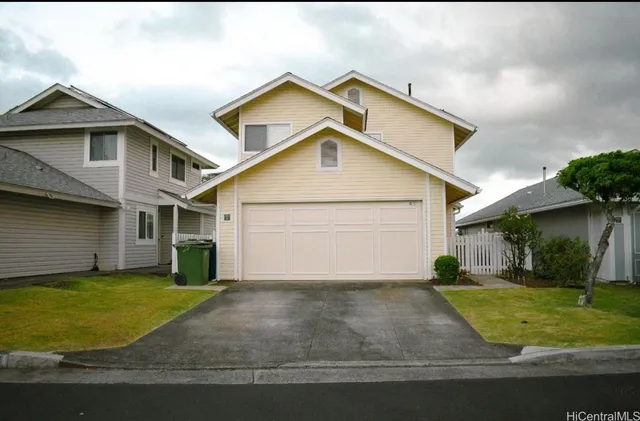 a view of a yard in front view of a house