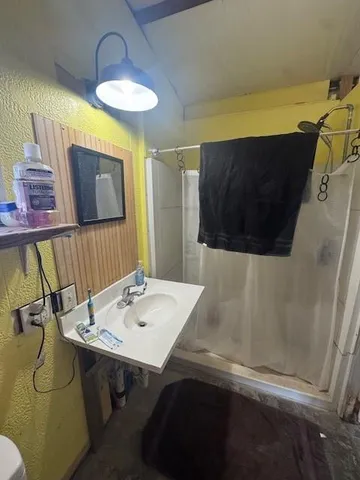 a bathroom with a sink and a mirror