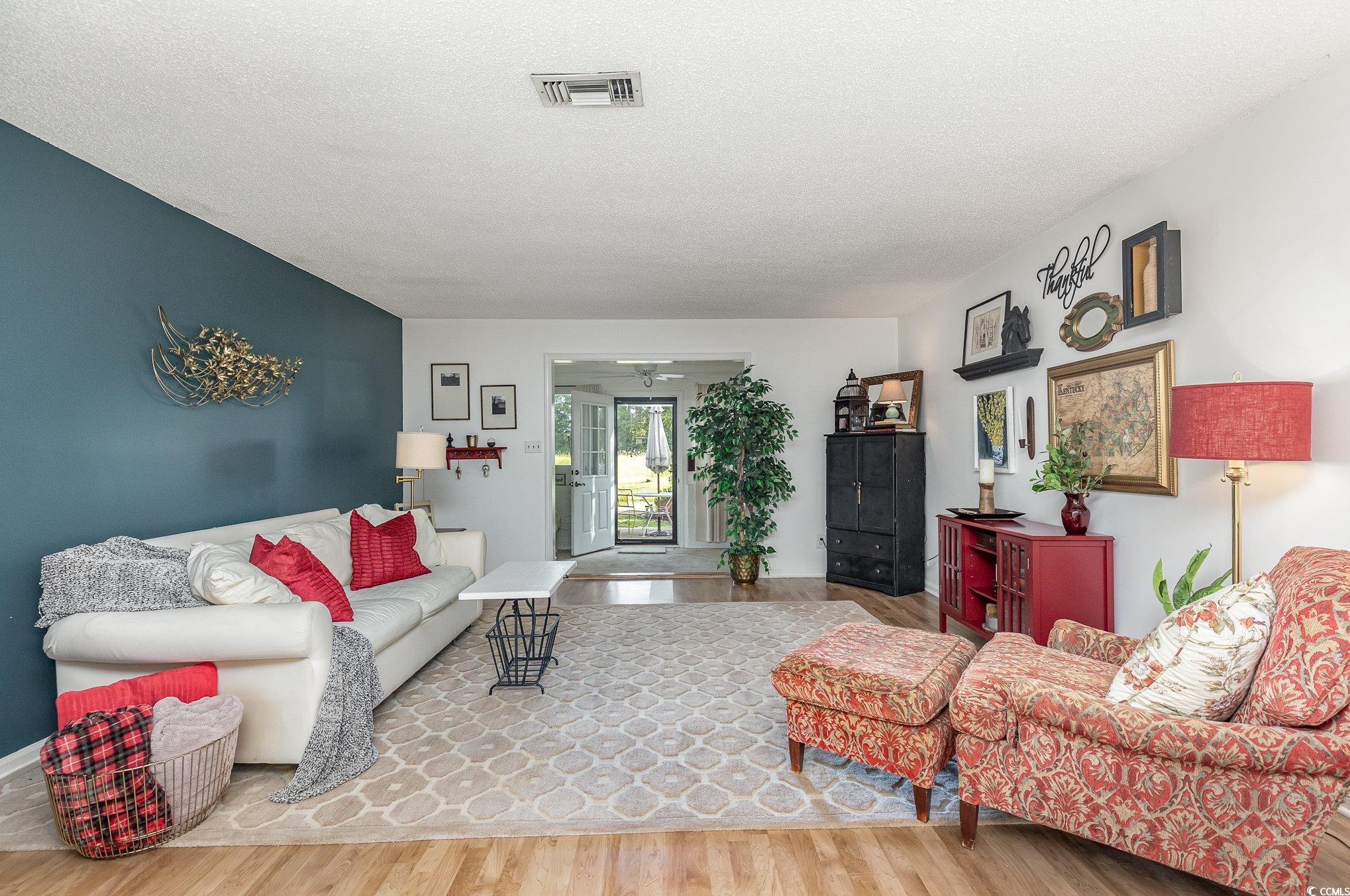 1830 Fairway Ridge Drive, Unit 6D Surfside Beach, SC 29575 - Photo 11 of 35 Living room with hardwood / wood-style flooring an