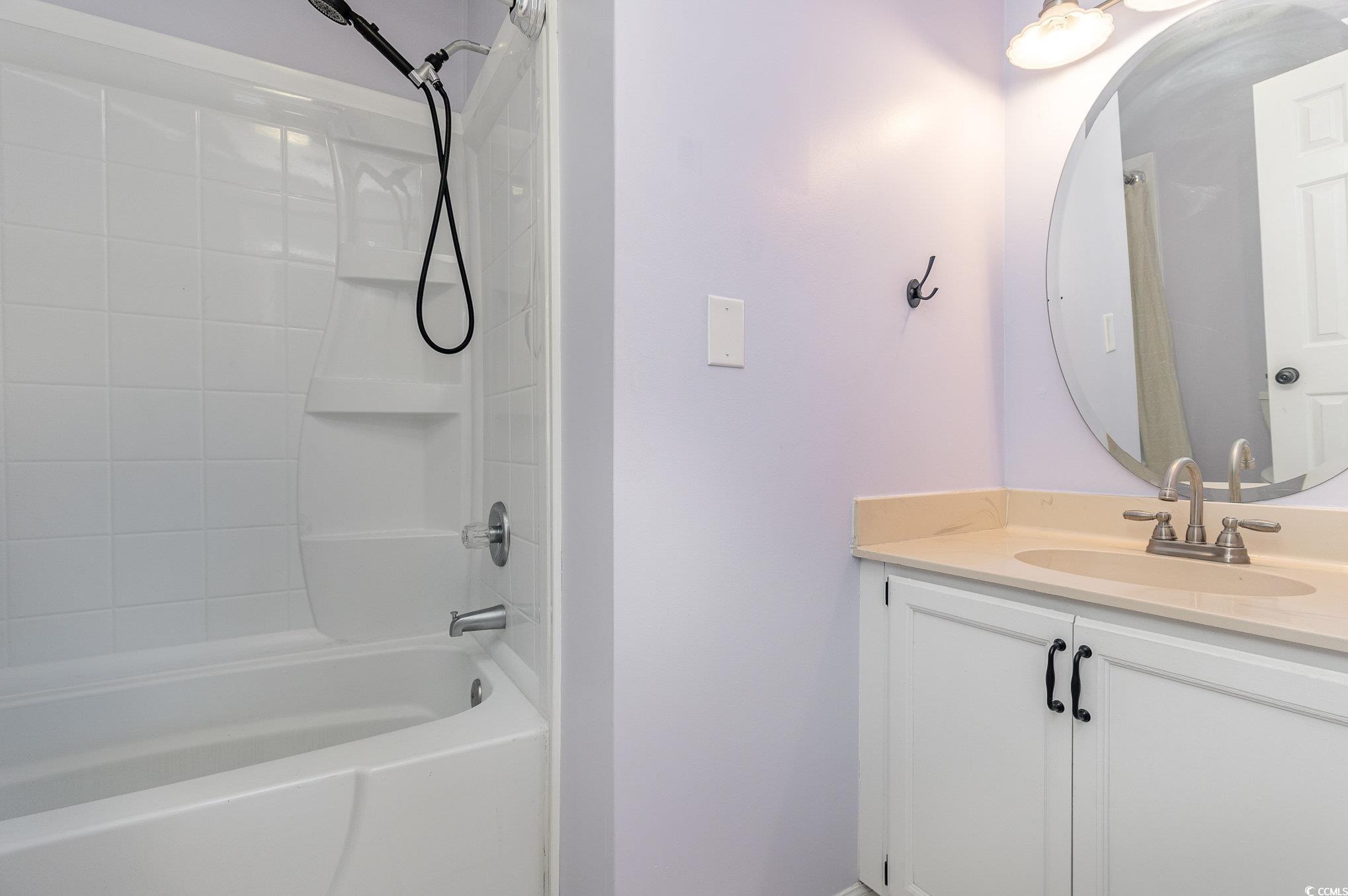 1830 Fairway Ridge Drive, Unit 6D Surfside Beach, SC 29575 - Photo 20 of 35 Bathroom featuring vanity and tub / shower combina