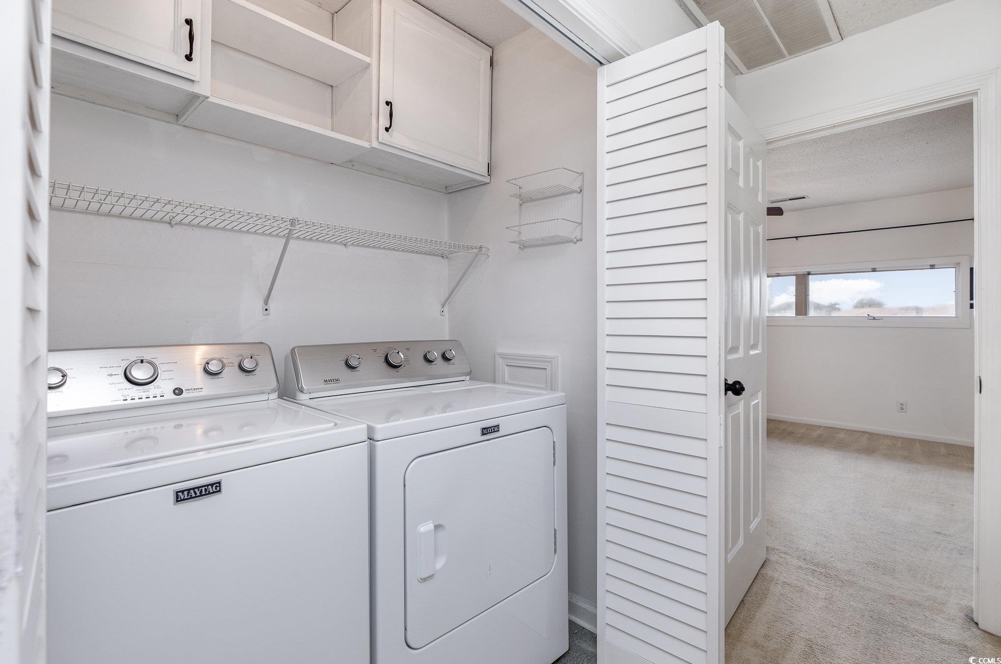 1830 Fairway Ridge Drive, Unit 6D Surfside Beach, SC 29575 - Photo 21 of 35 Laundry room featuring washing machine and clothes