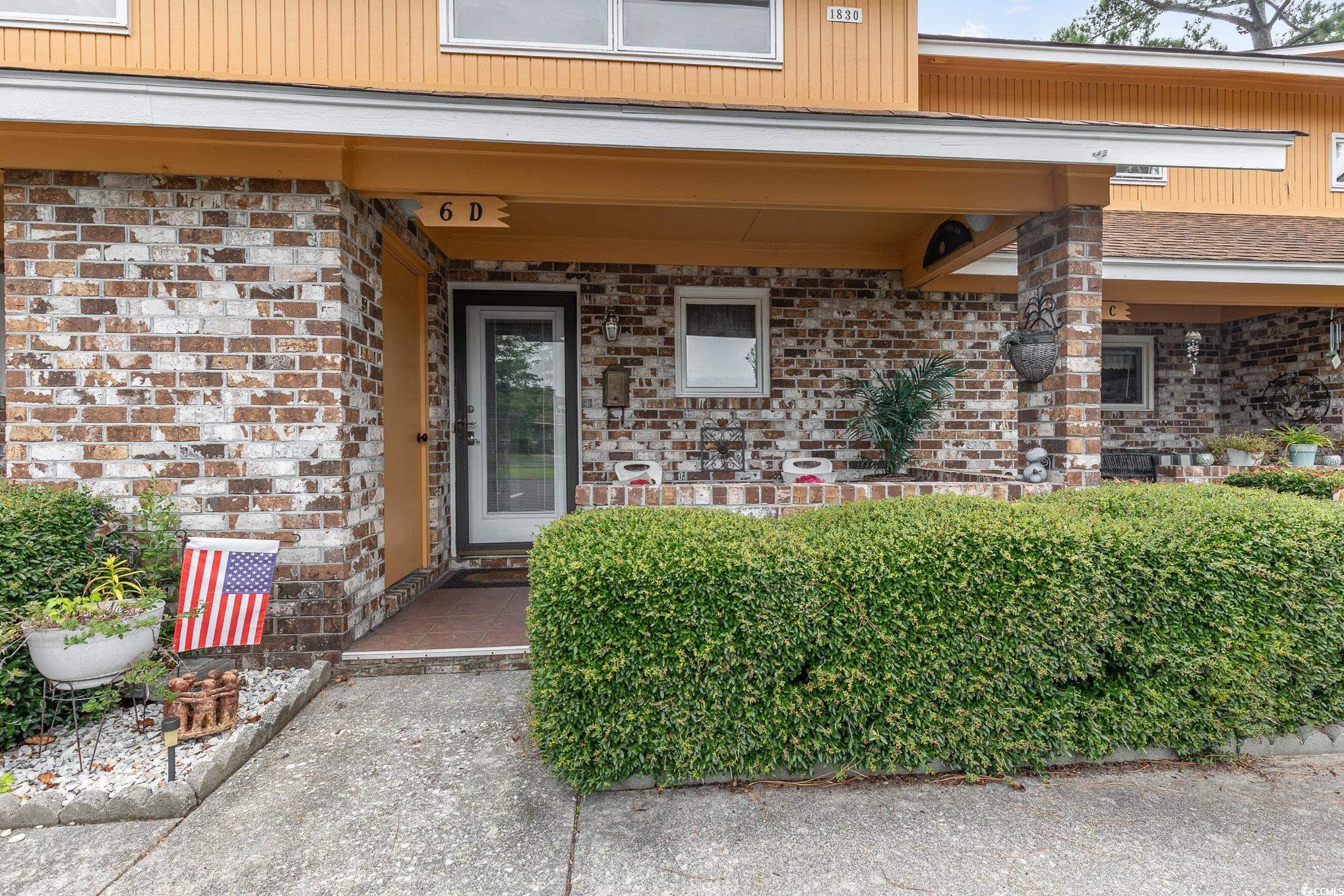 1830 Fairway Ridge Drive, Unit 6D Surfside Beach, SC 29575 - Photo 29 of 35 Property entrance featuring a porch