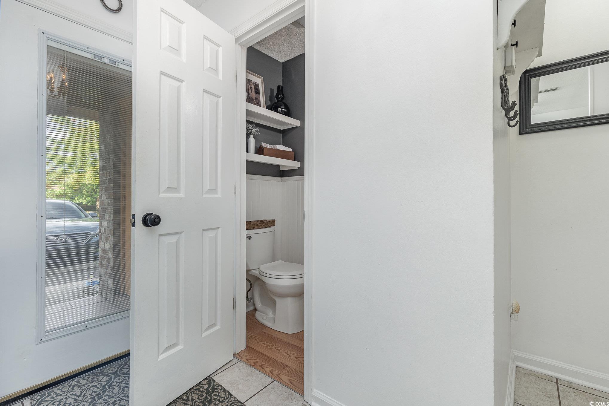 1830 Fairway Ridge Drive, Unit 6D Surfside Beach, SC 29575 - Photo 4 of 35 Interior space with toilet and tile patterned floo