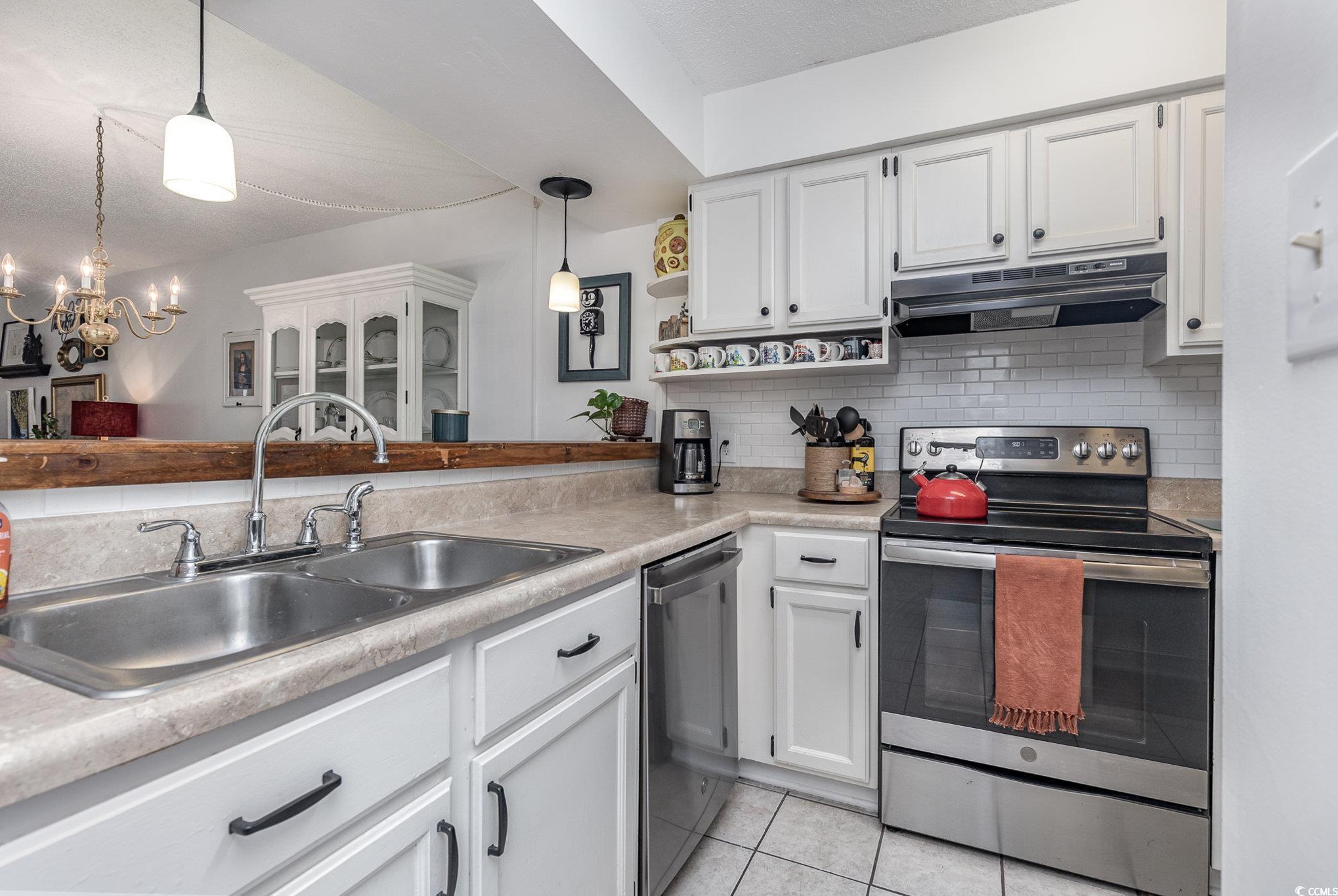 1830 Fairway Ridge Drive, Unit 6D Surfside Beach, SC 29575 - Photo 5 of 35 Kitchen with stainless steel appliances, decorativ
