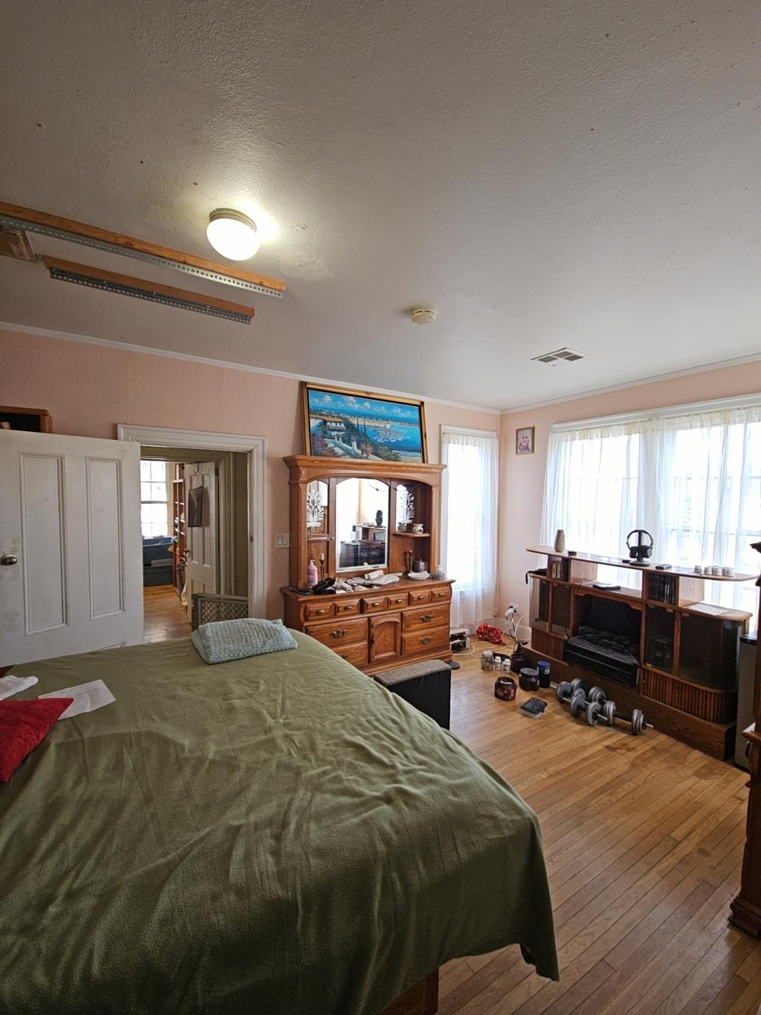 548 East Park Street Stockton, CA 95202 - Photo 16 of 29 a bedroom with a bed window and a television