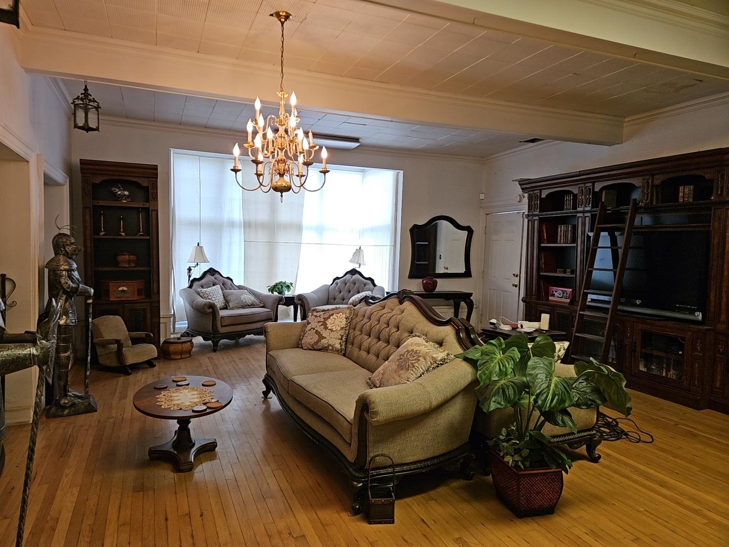 548 East Park Street Stockton, CA 95202 - Photo 7 of 29 a living room with furniture and a chandelier