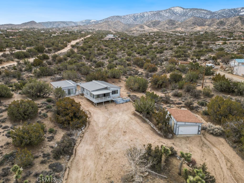 885 Tamarack Road Pinon Hills, CA 92372 - Photo 1 of 1 an aerial view of a house with a yard