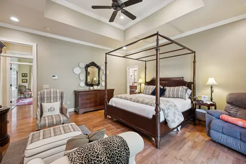 a living room with furniture a ceiling fan and a window