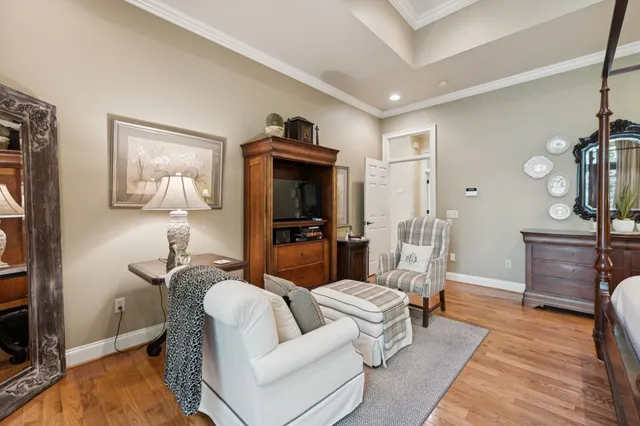 a view of a livingroom with furniture and hardwood floor