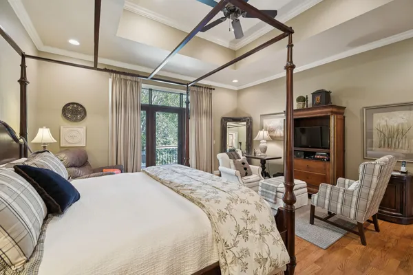 a living room with furniture a ceiling fan and a window