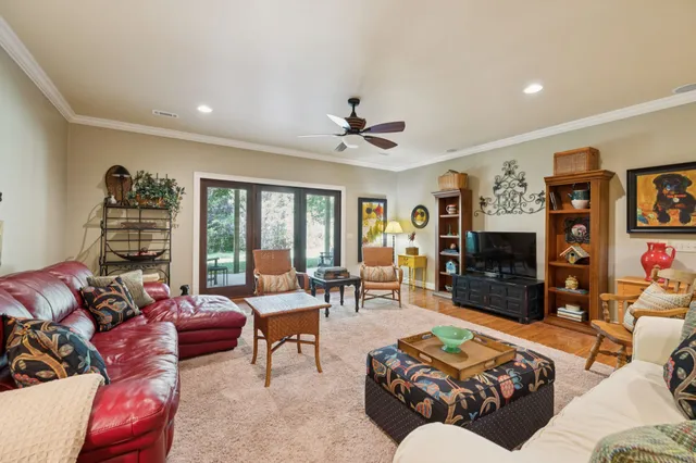 a view of a house with a yard and sitting area