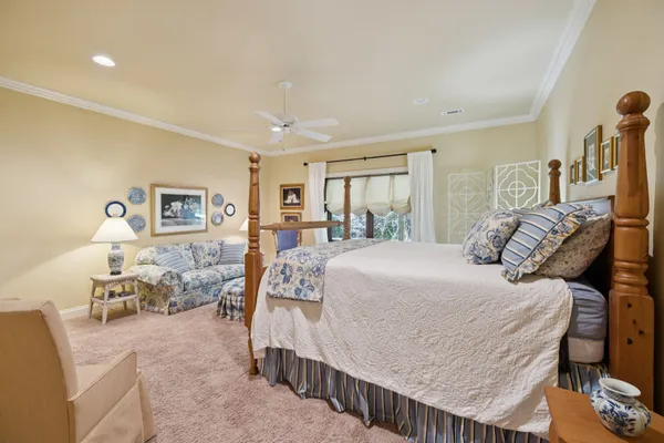 a view of house with chairs and table in a patio