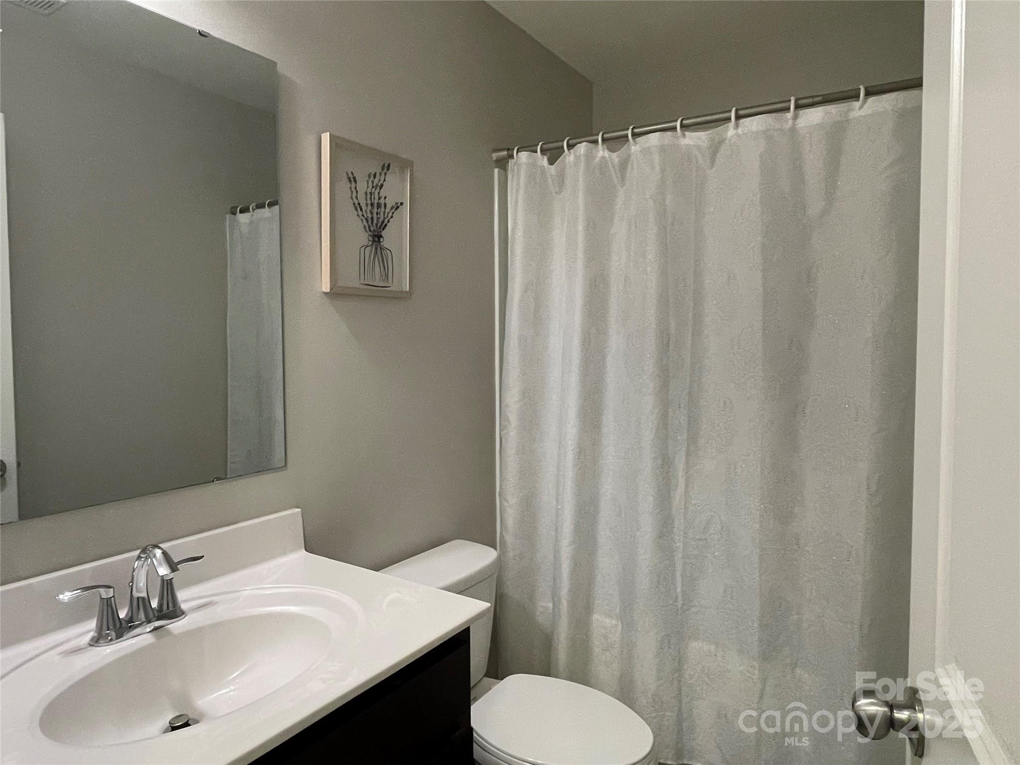 12417 Bryton Ridge Parkway Huntersville, NC 28078 - Photo 11 of 17 a bathroom with a sink and a toilet