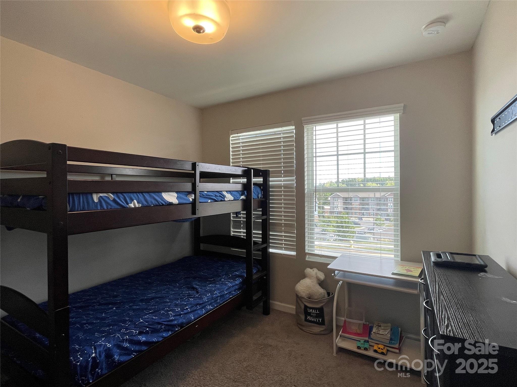 12417 Bryton Ridge Parkway Huntersville, NC 28078 - Photo 12 of 17 a bedroom with furniture and a window